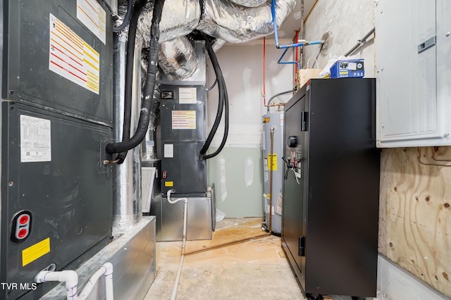 utility room featuring water heater and electric panel