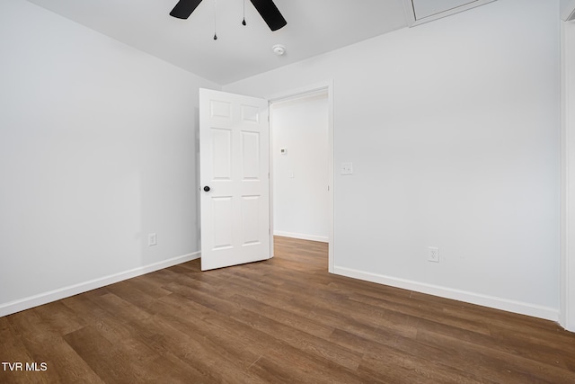 empty room featuring ceiling fan and dark hardwood / wood-style floors