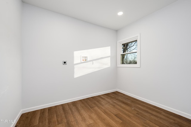 spare room with hardwood / wood-style flooring