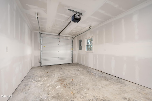 garage with a garage door opener and electric panel