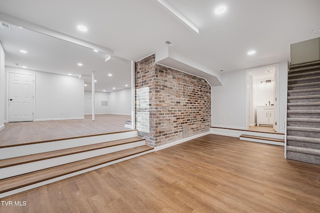 unfurnished living room with light wood-type flooring