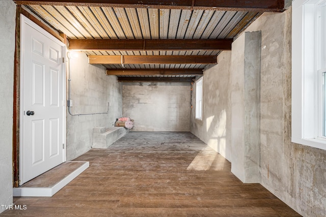 interior space with hardwood / wood-style flooring and wood ceiling