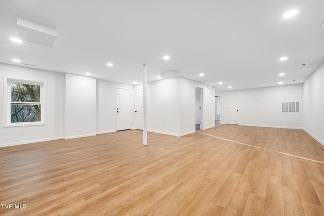 basement featuring light hardwood / wood-style floors