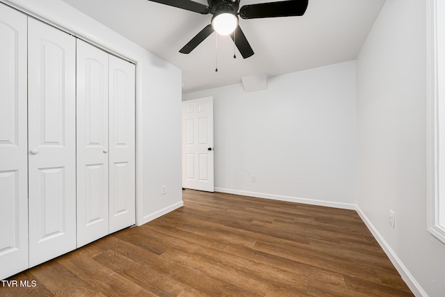 unfurnished bedroom with ceiling fan, hardwood / wood-style floors, and a closet