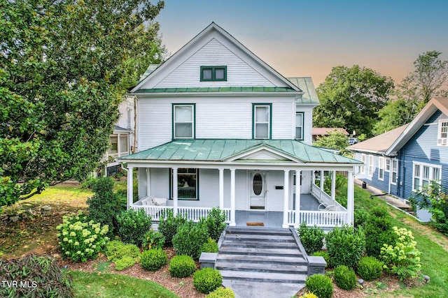 view of front of home featuring covered porch