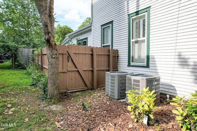 view of side of home with central AC unit