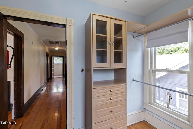 hallway with dark wood-type flooring