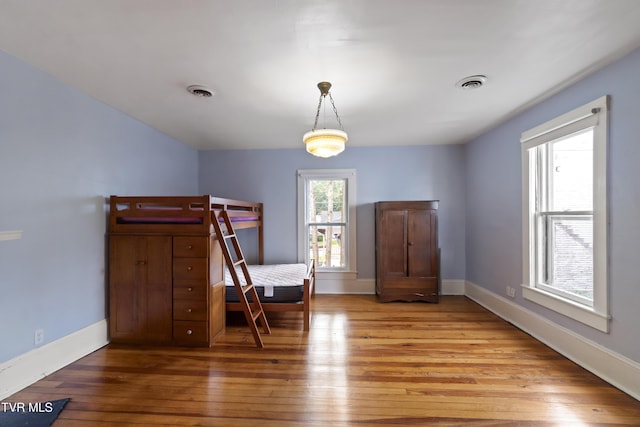 unfurnished bedroom featuring hardwood / wood-style flooring