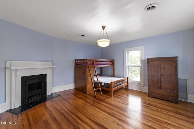 bedroom featuring wood-type flooring