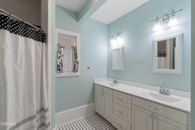 bathroom featuring a shower with curtain and vanity