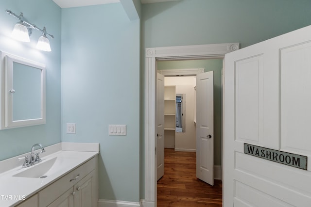 bathroom featuring wood-type flooring and vanity