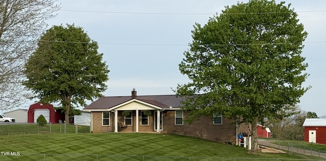 204 Dunford Cir, Limestone, TN 37681 - view of front of house featuring a front lawn, fence private yard, and brick siding