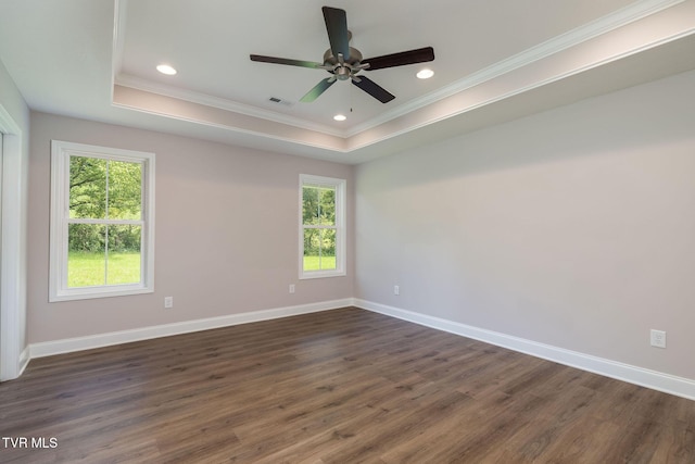 spare room featuring a raised ceiling, recessed lighting, baseboards, and visible vents