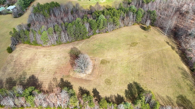 birds eye view of property with a rural view