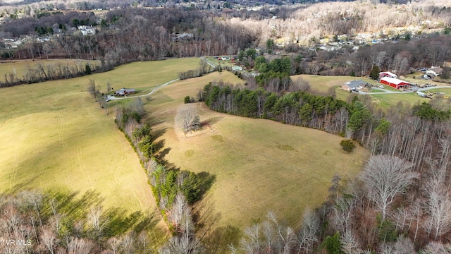 birds eye view of property with a rural view