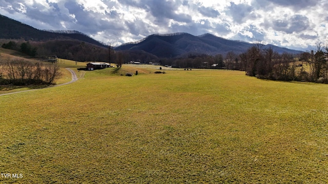 property view of mountains featuring a rural view