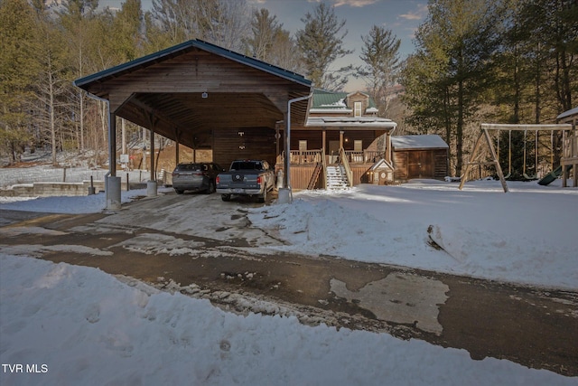 view of front of house with a carport and covered porch