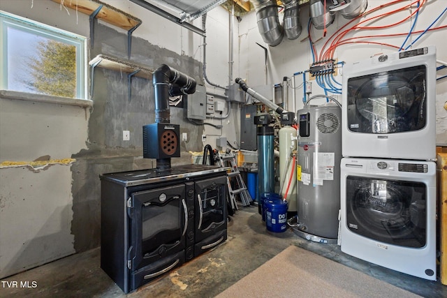 interior space with hybrid water heater and stacked washer and clothes dryer