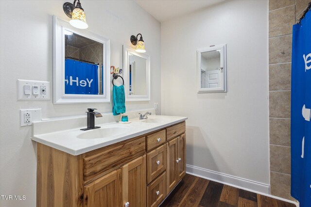 bathroom with vanity and hardwood / wood-style floors