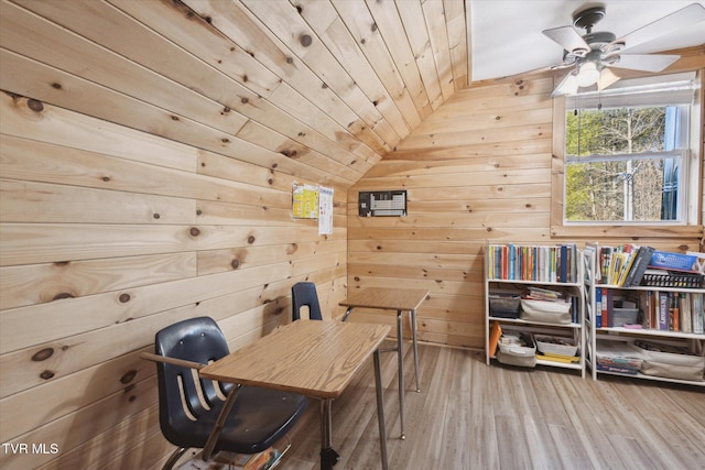 office featuring hardwood / wood-style floors, wooden walls, lofted ceiling, ceiling fan, and wood ceiling