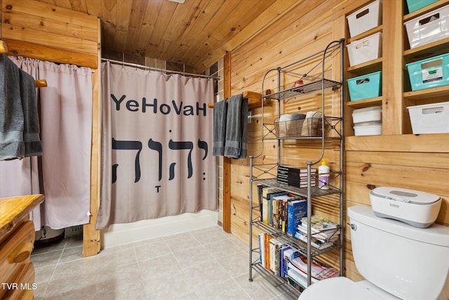 bathroom with wood ceiling, shower / bathtub combination with curtain, wooden walls, and toilet