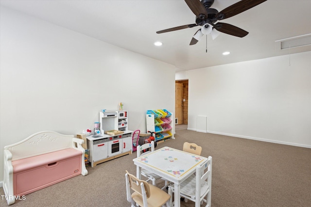 rec room with carpet flooring and ceiling fan