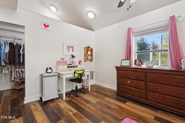 office space with vaulted ceiling, dark wood-type flooring, and ceiling fan