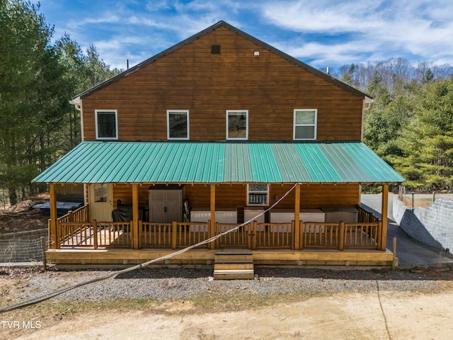 2191 Hubert Taylor Rd, Mountain City, TN 37683 - rear view of house featuring metal roof and log veneer siding