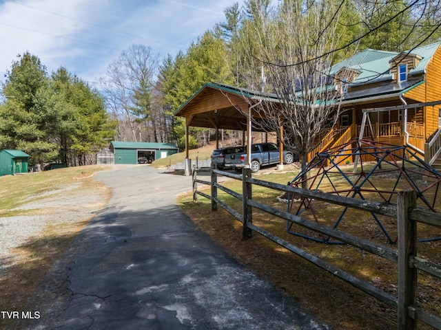 2191 Hubert Taylor Rd, Mountain City, TN 37683 - exterior space with aphalt driveway and fence