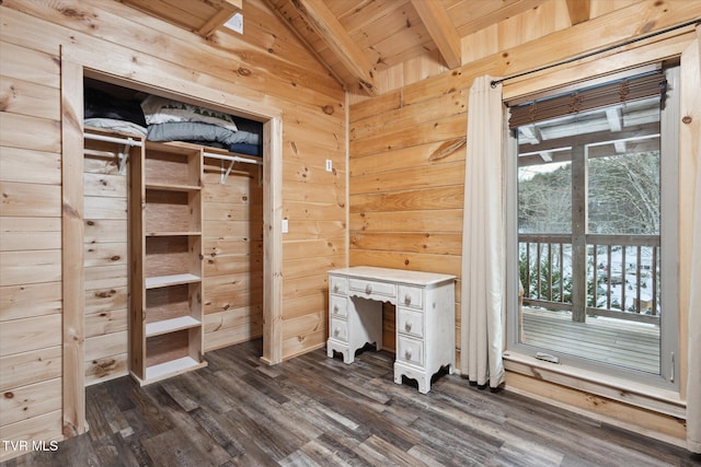 interior space featuring wood walls, dark hardwood / wood-style floors, wooden ceiling, and multiple windows