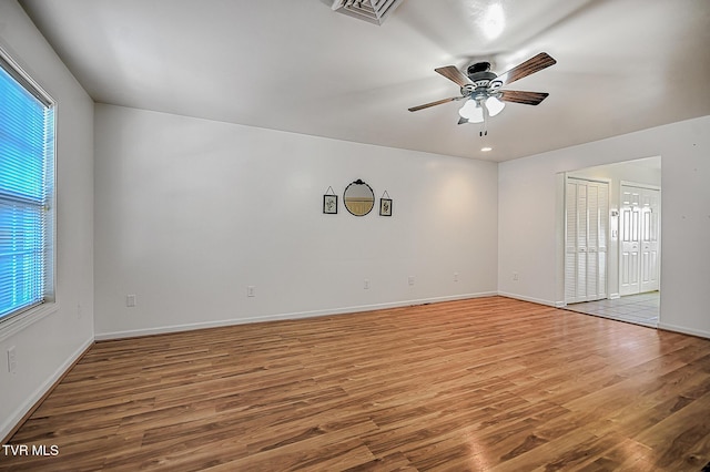 spare room with ceiling fan and hardwood / wood-style flooring