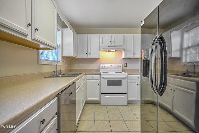 kitchen featuring light tile patterned floors, white cabinetry, dishwasher, and white electric range oven