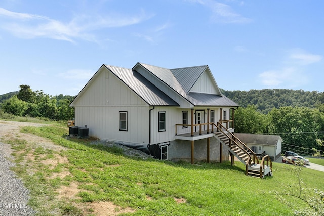 376 Wilcox Cir, Jonesborough, TN 37659 - rear view of house with a yard, metal roof, stairway, and central AC unit