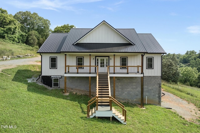 376 Wilcox Cir, Jonesborough, TN 37659 - back of property with stairs, a lawn, board and batten siding, and metal roof