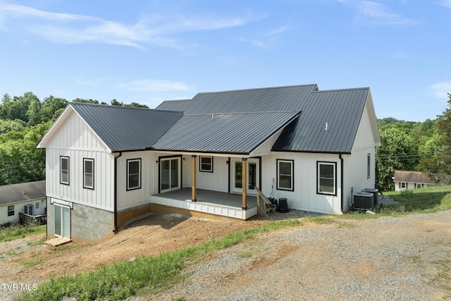 376 Wilcox Cir, Jonesborough, TN 37659 - modern farmhouse style home with a porch, cooling unit, board and batten siding, and metal roof