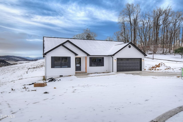 ranch-style home featuring a garage