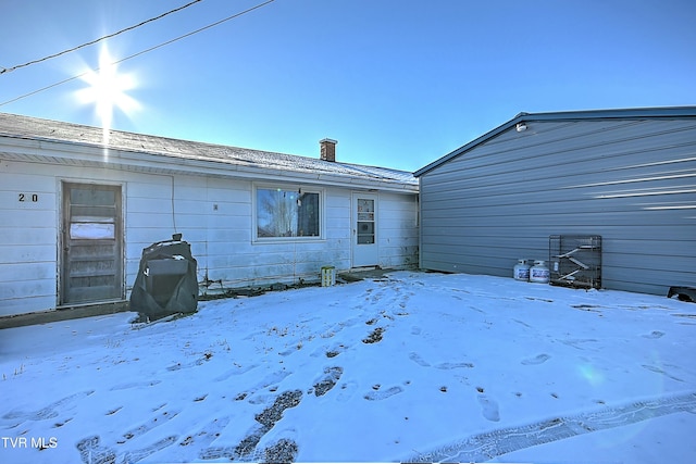 view of snow covered property