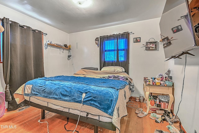 bedroom featuring wood-type flooring