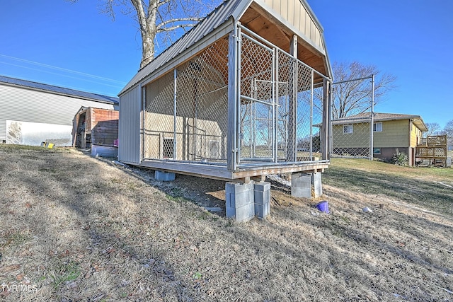 view of side of property with an outbuilding