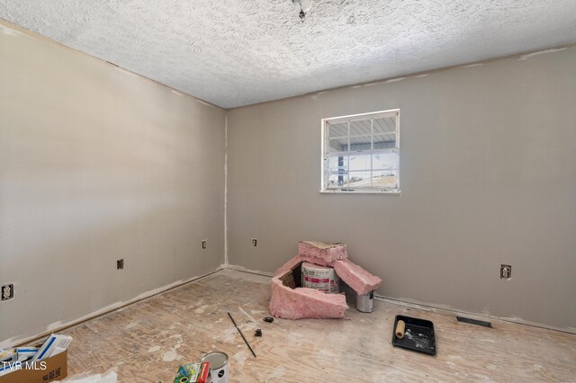 interior space featuring a textured ceiling