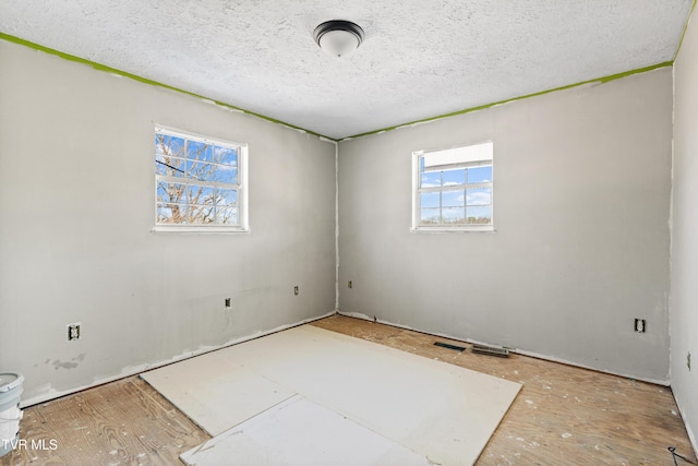 spare room featuring a textured ceiling