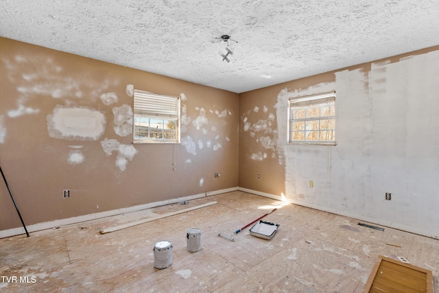 spare room featuring a textured ceiling