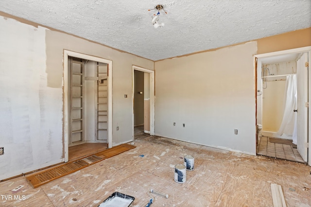 unfurnished bedroom featuring ensuite bathroom