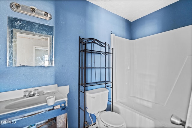 full bathroom featuring toilet, a textured ceiling, shower / bathtub combination, and sink