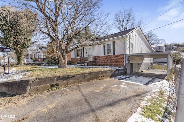 view of home's exterior featuring a carport