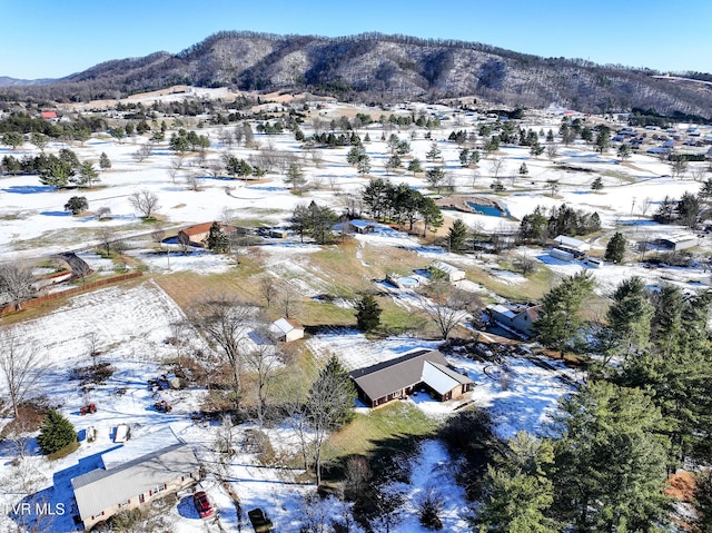 snowy aerial view with a mountain view