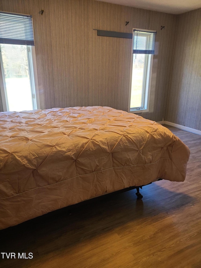 unfurnished bedroom featuring hardwood / wood-style flooring