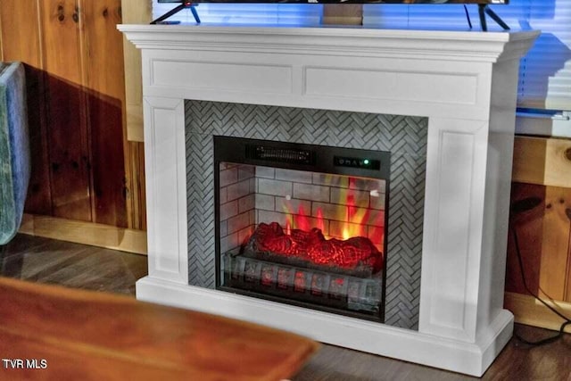 room details featuring a tiled fireplace