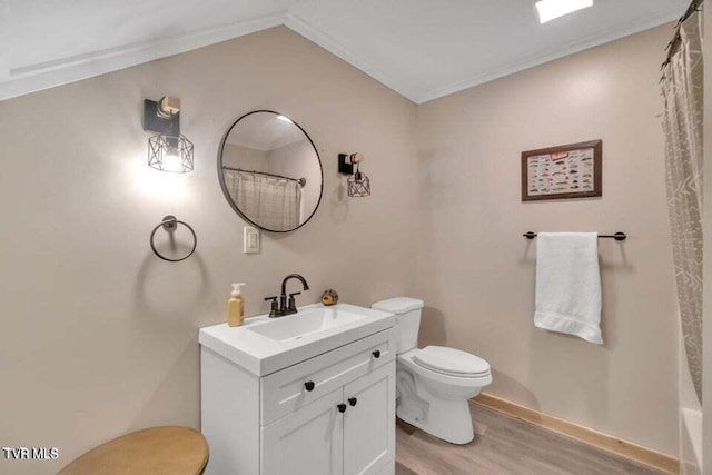 bathroom with a shower with curtain, toilet, wood-type flooring, vanity, and crown molding