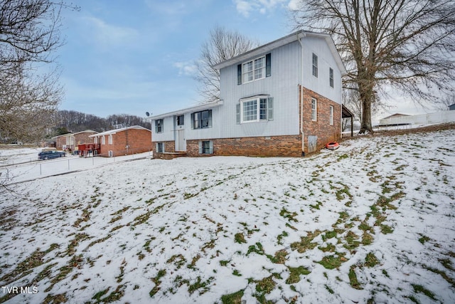 view of snow covered house